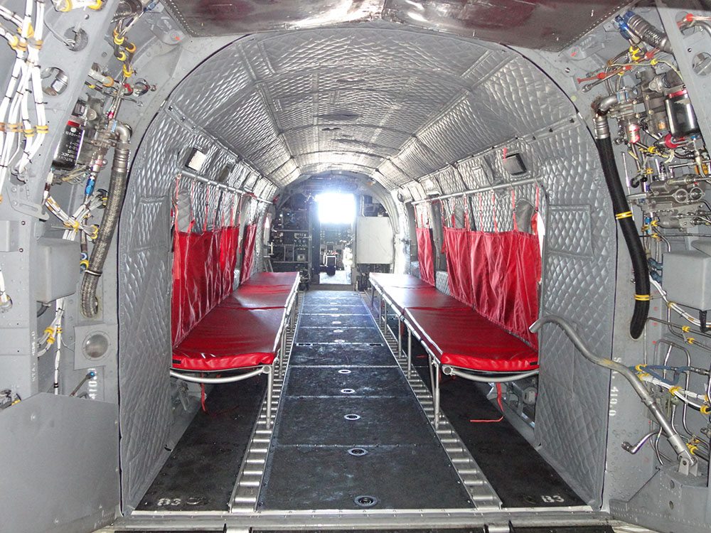 Modernized aircraft acoustical insulation blankets installed inside military transport cabin.
