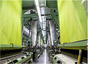 industrial-textile-loom-weaving-facility-ehmke High-volume industrial weaving looms producing high-tenacity technical fabrics at Ehmke Manufacturing.